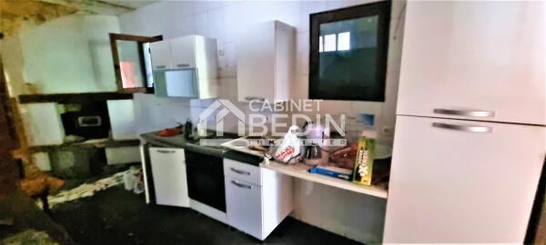 Batiment aménagé à rénover+terrain